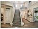Grand entryway with a staircase, high ceilings, and a pantry area featuring neutral color schemes at 2497 Birch Hollow St, Henderson, NV 89044