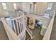 Bright foyer featuring wood floors, white banisters, and neutral walls at 2497 Birch Hollow St, Henderson, NV 89044