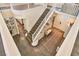 Spacious foyer with wood floors, staircase, and decorative mirrors on the wall at 2497 Birch Hollow St, Henderson, NV 89044