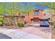 Charming two-story home with a beautiful brick driveway and well-maintained landscaping at 2497 Birch Hollow St, Henderson, NV 89044