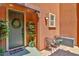 Welcoming front porch adorned with a wreath on the door at 2497 Birch Hollow St, Henderson, NV 89044