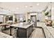 Open-concept kitchen with granite countertops, a large island, and stainless steel appliances at 2497 Birch Hollow St, Henderson, NV 89044