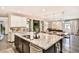 Open floor plan shows kitchen island with stainless appliances and dark wood floors at 2497 Birch Hollow St, Henderson, NV 89044