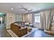 Comfortable living room with a cozy sectional sofa, hardwood floors, and stylish decor at 2497 Birch Hollow St, Henderson, NV 89044