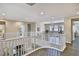 Upstairs loft area with exercise equipment overlooking the entryway with hardwood flooring and recessed lighting at 2497 Birch Hollow St, Henderson, NV 89044