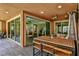Covered patio with ceiling fan, recessed lights, outdoor dining, and view of the living space through glass doors at 2497 Birch Hollow St, Henderson, NV 89044