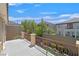 Balcony area with decorative metal railing and view of neighboring buildings and landscaping at 2753 Kildrummie St, Henderson, NV 89044