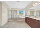 Bathroom with a separate shower and tub, double sink vanity, and tile flooring at 2753 Kildrummie St, Henderson, NV 89044