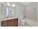 Well-lit bathroom with marble counters, sink, and shower-tub combo at 2753 Kildrummie St, Henderson, NV 89044