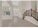 Grand foyer with high ceilings, chandelier, staircase, and tile flooring at 2753 Kildrummie St, Henderson, NV 89044