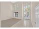 Grand foyer boasts soaring ceilings, decorative chandelier, and tile flooring at 2753 Kildrummie St, Henderson, NV 89044