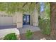 Home's entrance featuring a beautiful double door and manicured landscaping at 2753 Kildrummie St, Henderson, NV 89044