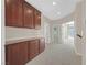 Spacious hallway features built-in storage cabinets and neutral carpeting at 2753 Kildrummie St, Henderson, NV 89044