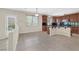 Kitchen eat-in area featuring dark wood cabinets and granite countertops, plus backyard access at 2753 Kildrummie St, Henderson, NV 89044