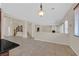 Spacious living area with tile floors, stairs, and plenty of natural light at 2753 Kildrummie St, Henderson, NV 89044