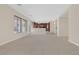 Bright open-concept living room with neutral colors and large windows for natural light at 2753 Kildrummie St, Henderson, NV 89044