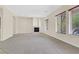 Living room featuring a fireplace and large windows at 2753 Kildrummie St, Henderson, NV 89044