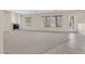 Spacious living room with a fireplace, large windows, and an access door at 2753 Kildrummie St, Henderson, NV 89044