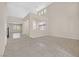 Open living room featuring tile floors, carpeted areas, and staircase at 2753 Kildrummie St, Henderson, NV 89044