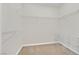 A walk-in closet equipped with wire shelving units and neutral carpeting at 2753 Kildrummie St, Henderson, NV 89044
