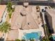 An aerial view of the tile roof, backyard pool, and landscaped grounds at 277 Dark Forest Ave, Las Vegas, NV 89123