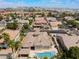 Aerial view of the home in a community with a pool, spa, and surrounding homes at 277 Dark Forest Ave, Las Vegas, NV 89123