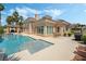 Beautiful backyard boasts a refreshing pool, lush landscaping, and a charming covered patio at 277 Dark Forest Ave, Las Vegas, NV 89123