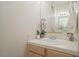 Compact half bathroom featuring a simple vanity and neutral decor at 277 Dark Forest Ave, Las Vegas, NV 89123