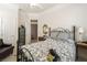 Inviting bedroom features a wrought iron bed frame and stylish black and white patterns at 277 Dark Forest Ave, Las Vegas, NV 89123