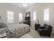 Comfortable bedroom boasts shuttered windows, a plush chair and soft, neutral tones at 277 Dark Forest Ave, Las Vegas, NV 89123