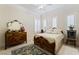 Cozy bedroom with a patterned bedspread, wood furnishings, and a large area rug at 277 Dark Forest Ave, Las Vegas, NV 89123