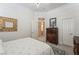 Cozy bedroom featuring a decorative mirror, a floral quilt and classic furnishings at 277 Dark Forest Ave, Las Vegas, NV 89123
