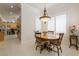 Charming dining area with a round table, adjacent to the kitchen, offering a cozy and functional space at 277 Dark Forest Ave, Las Vegas, NV 89123