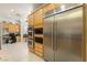 Modern kitchen with stainless steel KitchenAid refrigerator and built-in microwave and oven at 277 Dark Forest Ave, Las Vegas, NV 89123