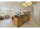 Spacious kitchen island with granite counters opens to the living room with fireplace and backyard views at 277 Dark Forest Ave, Las Vegas, NV 89123