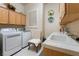 Efficient laundry room equipped with modern washer and dryer units plus ample counter space at 277 Dark Forest Ave, Las Vegas, NV 89123