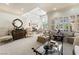 Open-concept living area with fireplace, dining space, and large windows, ideal for entertaining and relaxing at 277 Dark Forest Ave, Las Vegas, NV 89123