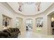 Spacious living area with architectural details, arched doorways, and an ornate decorative art piece at 277 Dark Forest Ave, Las Vegas, NV 89123