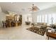Bright living area with tile flooring, shutters, and an open layout leading to the kitchen and dining spaces at 277 Dark Forest Ave, Las Vegas, NV 89123
