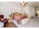 Bright main bedroom offering neutral walls, patterned bedding, with an area rug at 277 Dark Forest Ave, Las Vegas, NV 89123