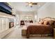 Spacious main bedroom featuring plush bedding, fireplace, and seating area with beautiful backyard views at 277 Dark Forest Ave, Las Vegas, NV 89123