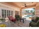 Outdoor patio includes plush seating and an inviting view of the pool and backyard at 277 Dark Forest Ave, Las Vegas, NV 89123