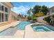 Stunning pool and spa with lush landscaping create a private and relaxing backyard oasis at 277 Dark Forest Ave, Las Vegas, NV 89123
