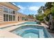 Lush backyard with a pool and spa offers a luxurious retreat for relaxation and outdoor enjoyment at 277 Dark Forest Ave, Las Vegas, NV 89123