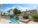 Beautiful backyard features a pool, spa, and lush landscaping, creating a private oasis for relaxation and enjoyment at 277 Dark Forest Ave, Las Vegas, NV 89123