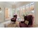 A relaxing sitting area within the main bedroom offers a private exit to the backyard and natural lighting at 277 Dark Forest Ave, Las Vegas, NV 89123