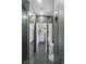 Contemporary bathroom featuring dark tile and a glass shower at 3111 Bel Air Dr # 27E, Las Vegas, NV 89109