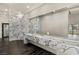 Contemporary bathroom featuring marble countertops, dual sinks, and a separate glass-enclosed shower at 3111 Bel Air Dr # 27E, Las Vegas, NV 89109