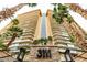 Majestic high-rise building featuring expansive balconies and is surrounded by lush palm trees at 3111 Bel Air Dr # 27E, Las Vegas, NV 89109