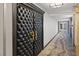 Luxurious hallway with tufted door, decorative carpet and gold hardware at 3111 Bel Air Dr # 27E, Las Vegas, NV 89109
